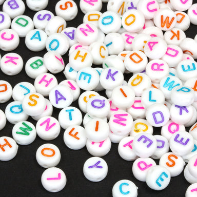 Flat round plastic white beads with coloured mix of letters 