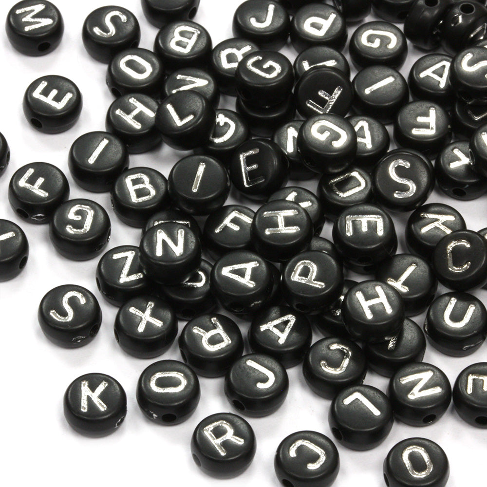 Silver Letters on Black Rounds 4x7mm - Pack of 200