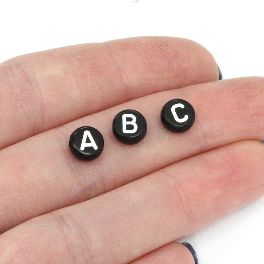 White Letters on Black Rounds 4x7mm - Pack of 200
